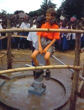 1. Ryan and Jimmy meeting for the first time at the Angolo Primary School well, Uganda (2000)